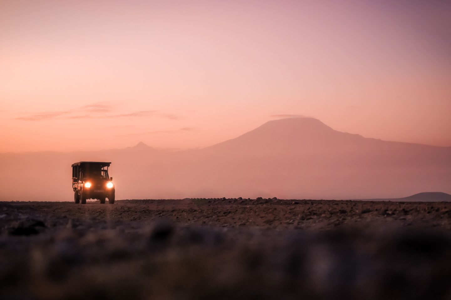 The outline of Kilimanjaro against a pink dawn sky