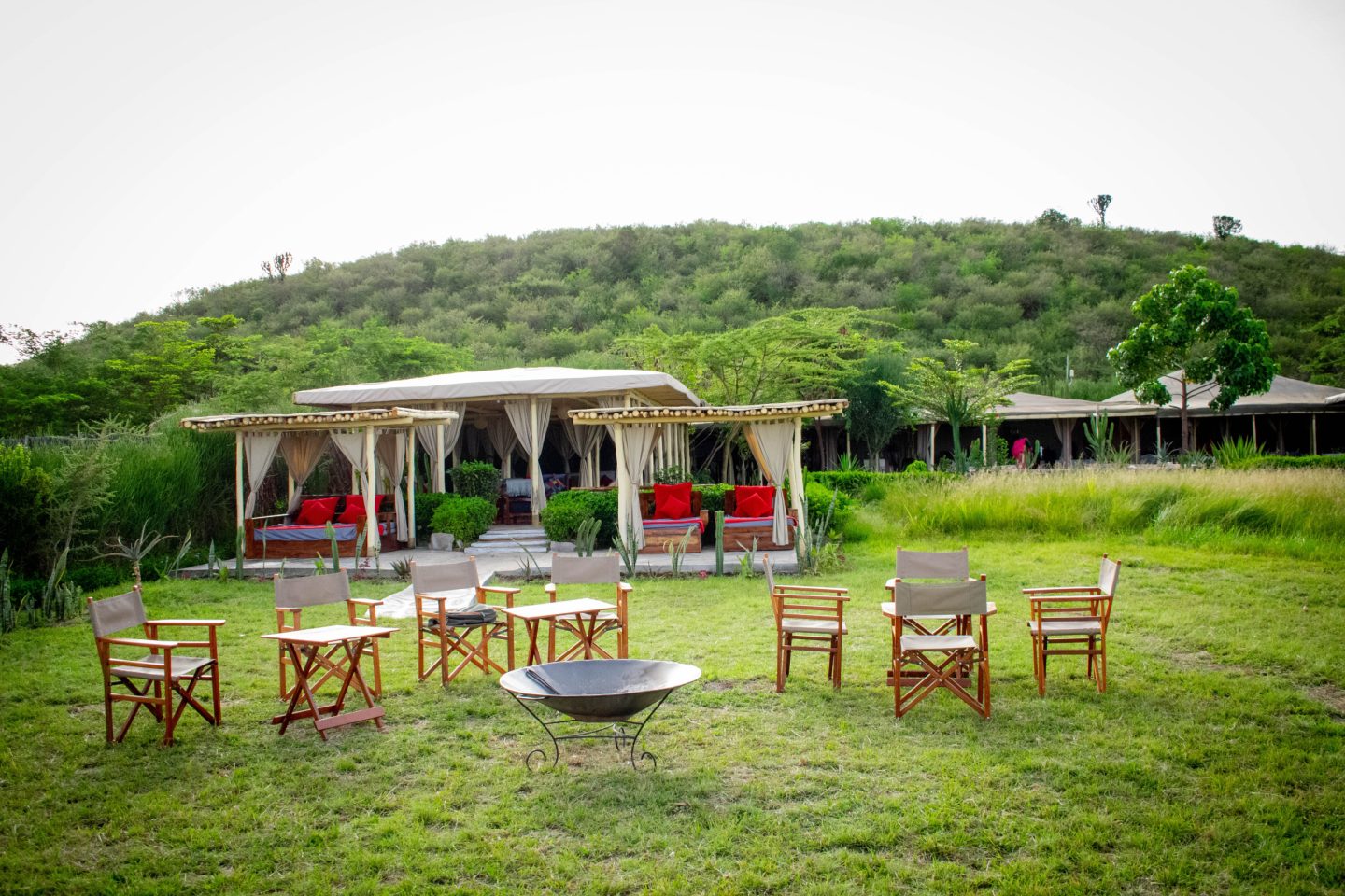 Open-sided seating on a lawn looking out across low hills